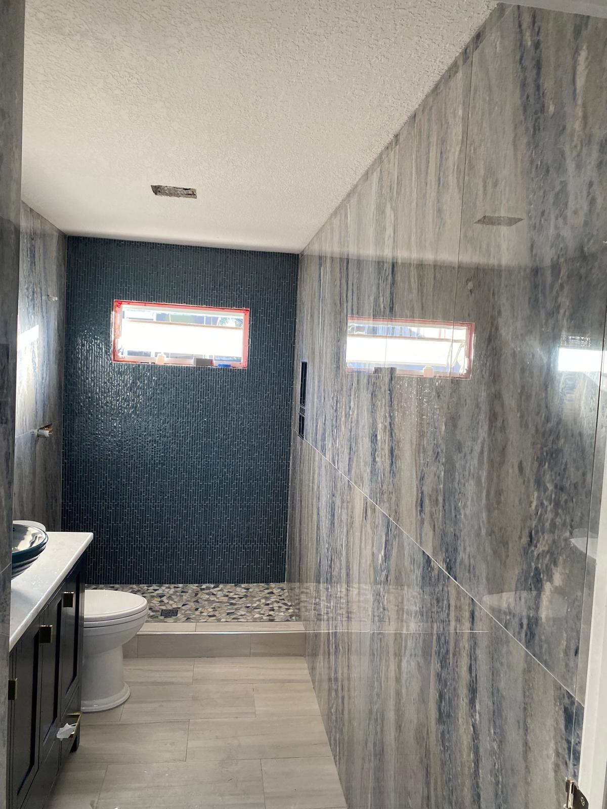 Blue glass mosaic tile detail similar to pool waterline work